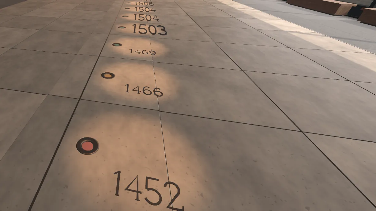 A stone floor with years cut into it in a line, each beside a small round stud. The nearest stud is red. A still from the museum's film.